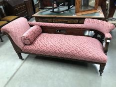 A Victorian mahogany chaise longue recently re-upholstered.