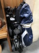 2 gold trolley's, 2 gold bags and a good lot of golf clubs.
