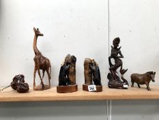 A collection of carved wood animals etc.