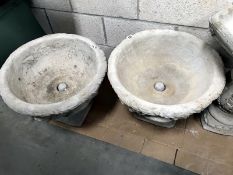 2 large garden urns decorated with acanthus leaves.