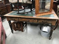 A leather topped library table.