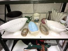 A shelf of garden and plant pots.