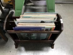 A wooden magazine rack and a quantity of records.