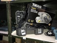 A boxed Titan sander