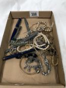 A mixed lot of costume jewellery and pens.