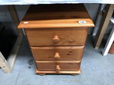 A 3 drawer bedside chest.