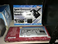 A socket set (new & sealed) & an emergency vehicle shovel