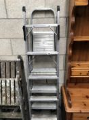 An extending aluminium ladder and an aluminium trestle ladder.