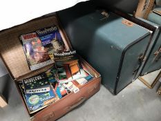 A case of woodworking magazines and a vintage case.