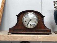 A mantel clock.