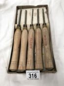 A box set of 5 wood carving chisels.