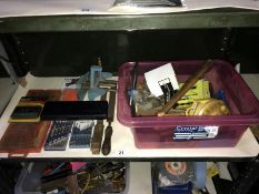 A shelf of tools including screwdrivers & vice etc.