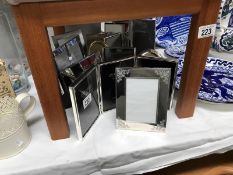 A quantity of silver plate photo frames.