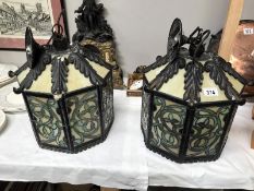 A pair of Gothic style ceiling lanterns.