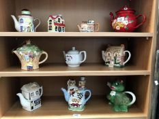 3 shelves of novelty teapots.