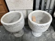 2 Mayan urn circular garden planters decorated with Aztec design.