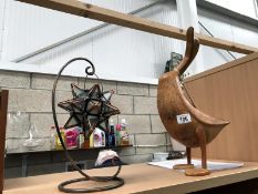 A wooden duck and a sputnik? candle holder.