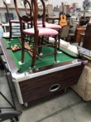 A pool table with accessories.