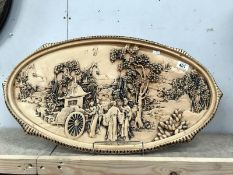 An oval plaque with Chinese scene.