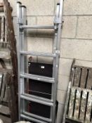 An EN131 Pro-Deck multi use aluminium ladder with end bars and work platform.
