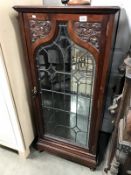 A lead glazed cabinet (glass a/f).