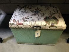 A small ottoman with padded top