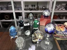 A quantity of glass paperweights.