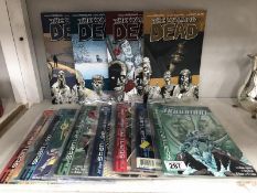 A quantity of Stan Lee's D.C. Comics and Volumes 1,2,3 and 4 of The Walking Dead.