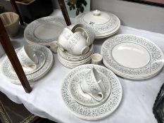 Approximately 30 pieces of Royal Doulton Arabesque pattern table ware.