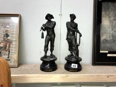 A pair of spelter figures being a blacksmith and a miner.