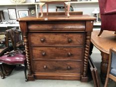 A Victorian mahogany 4 drawer Scotch chest with barley twist columns.