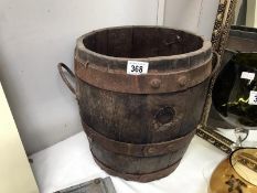 A large barrel plant pot.