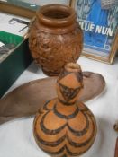 A wooden vase and 2 other wooden items.