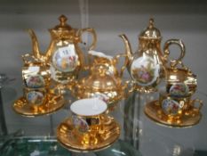 A gilded coffee set.