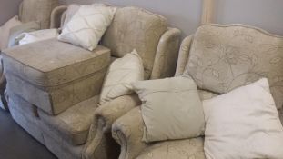 A 3 seater suite and pouffe