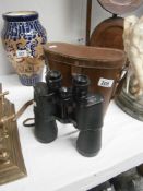A cased pair of binoculars.