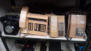 A Shelf Of Vintage Telephones