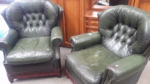 2 green leather chairs
