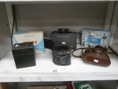 A collection of vintage cameras including Solar and Polaroid