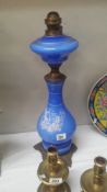 A blue glass and metal oil lamp base with Grecian scene