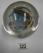 An unusual paperweight featuring central ball with Chinese dragon scene