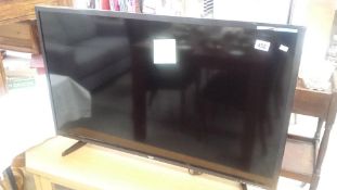 A Bush 40" LED Television And Television Cabinet