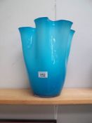 A turquoise art glass vase.