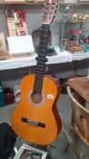 A Hohner Accoustic Guitar With Case (Stand Not Included)