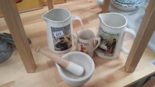 3 Advertising Bar Jugs And A Pestle And Mortar