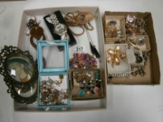 An interesting collection of jewellery, frames,