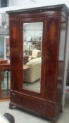 A mahogany inlaid wardrobe