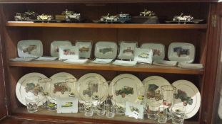 A quantity of dishes and glasses depicting old cars