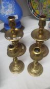 2 pairs of brass candlesticks