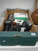 A box of assorted photographic equipment.